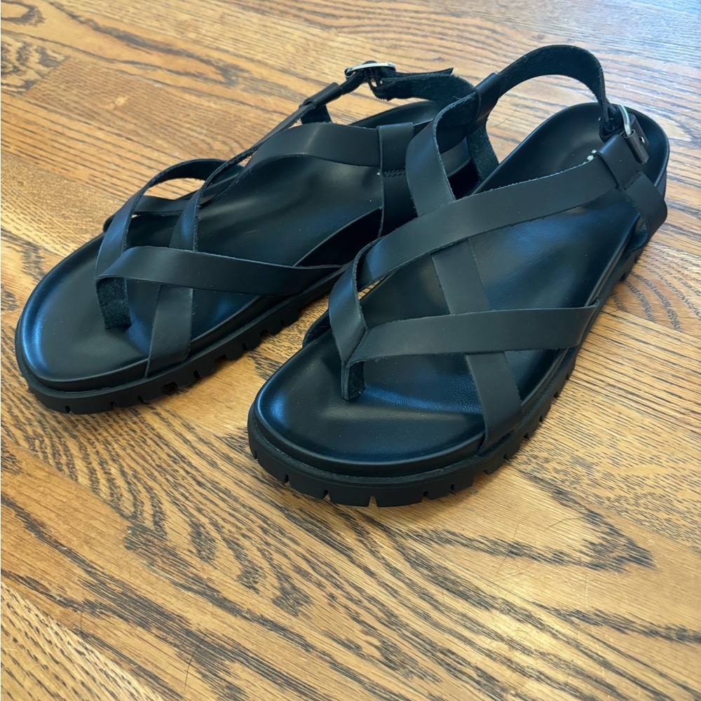 Not doc’s but darn close! Black leather straps with a comfy rubber footbed.